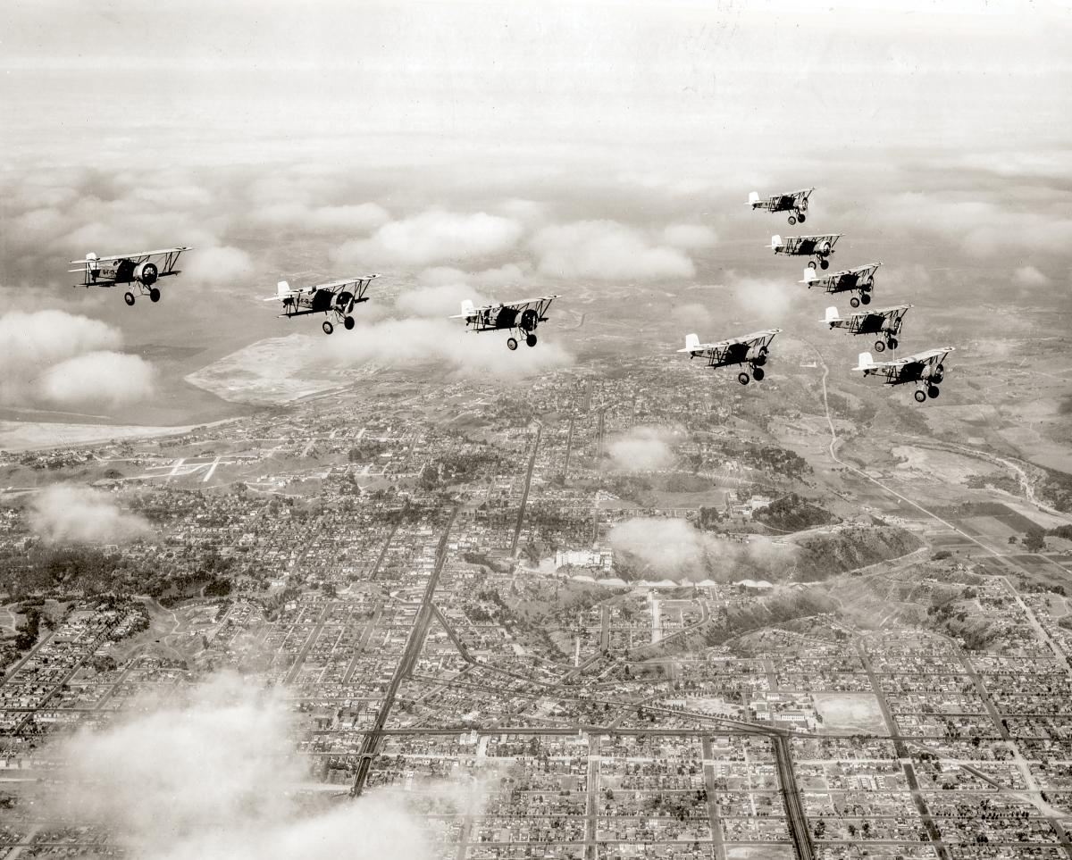 Air-to-air view of Curtiss F6C fighters fly in formation over San Diego in 1931